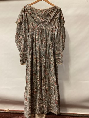 Lot 2111 - 1834/1835 Georgian maternity day dress in Indian printed cotton with tiny crochet edging, bodice has feeding openings which have been closed with small stitches. Large gigot sleeves narrowing to...