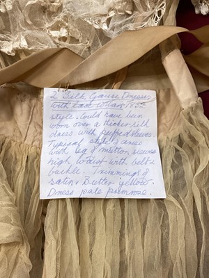 Lot 2112 - 1832 pair Georgian silk gauze dresses with satin trims, intended to be worn over an outer dress, worn as bridemaid dresses. High waisted , one with original ribbon belt and buckle, gigot sleeves (...