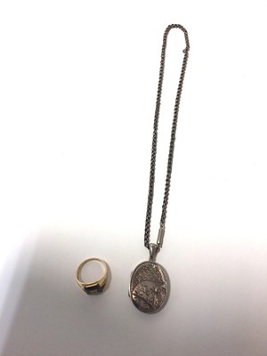 Lot 38 - Late Victorian silver/white metal oval locket on chain together with a yellow metal and black onyx signet ring, stamped 10k. (2)