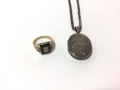 Lot 38 - Late Victorian silver/white metal oval locket on chain together with a yellow metal and black onyx signet ring, stamped 10k. (2)