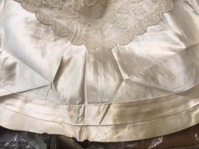 Lot 2117 - 1845 Victorian wedding dress in cream silk folded pleats on boned bodice with pointed waistline, two tier sleeves, detachable large bow to be worn at the waist, matching short cape silk cape trimme...