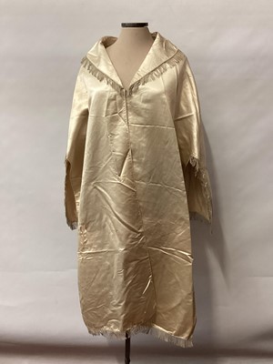 Lot 2117 - 1845 Victorian wedding dress in cream silk folded pleats on boned bodice with pointed waistline, two tier sleeves, detachable large bow to be worn at the waist, matching short cape silk cape trimme...