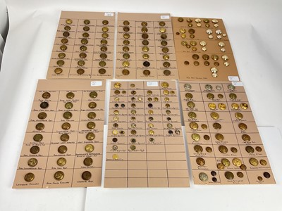 Lot 569 - Six boards mounted with an annotated display of British military regimental buttons.