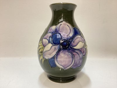 Lot 1251 - Moorcroft pottery vase decorated in the Anemone pattern on green ground, impressed marks to base, 19cm high