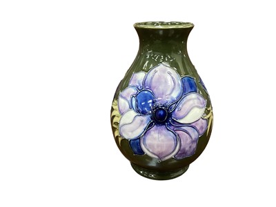 Lot 1121 - Moorcroft pottery vase decorated in the Anemone pattern on green ground, impressed marks to base, 19cm high