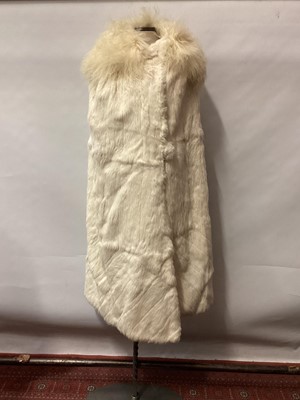 Lot 2121 - 1930s white fur possibly ermine, evening cloak lined in cream silk and round fur covered button fastening,  lamb's fleece collar.