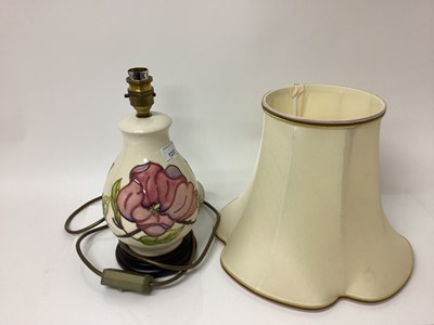 Lot 1257 - Moorcroft pottery table lamp decorated in the Magnolia pattern, with shade