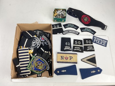 Lot 574 - Collection of cloth Police rank badges and insignia, together with a tin of metal Police badges.