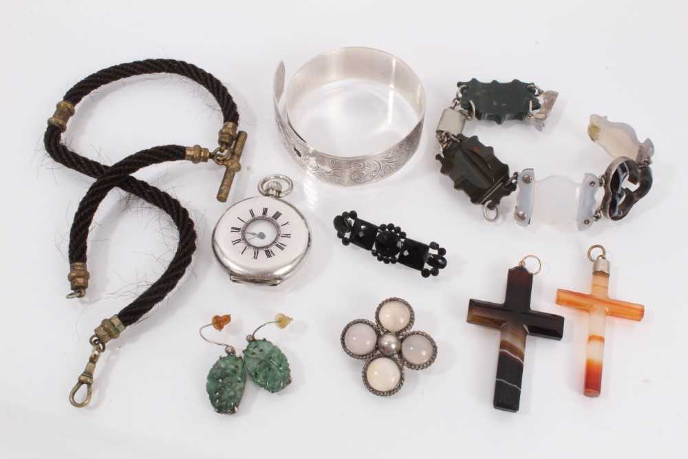 Lot 875 - Group of antique and later jewellery including two agate cross pendants, hard stone panel bracelet, pair of green carved hard stone earrings, hairwork watch chain, two brooches, silver bangle and a...