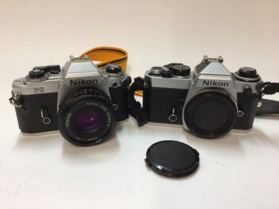 Lot 2367 - Nikon FG 35mm SLR camera with 50mm f/1.8 lens, and a Nikon FE body