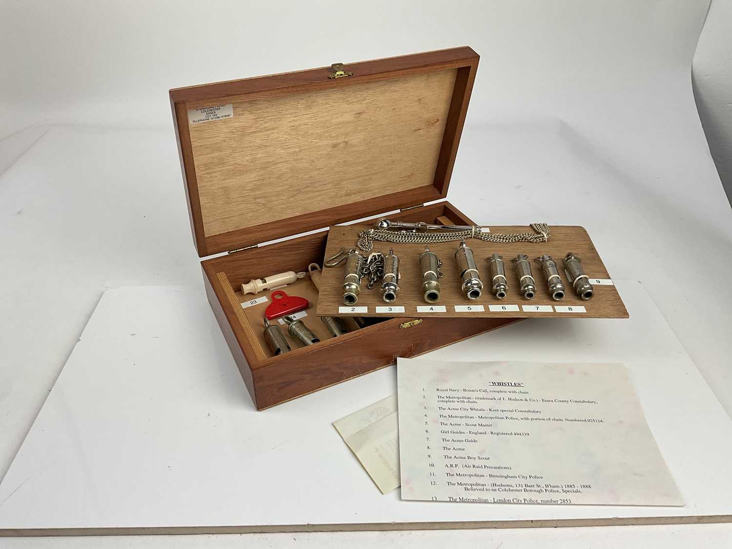 Lot 588 - Collection of twenty three whistles to include Essex Constabulary, Kent Special Constabulary, A.R.P. and others, in a wooden case with annotated list.