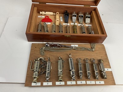 Lot 588 - Collection of twenty three whistles to include Essex Constabulary, Kent Special Constabulary, A.R.P. and others, in a wooden case with annotated list.