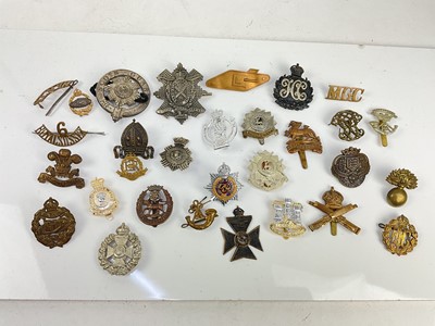 Lot 591 - Collection of thirty British military cap badges to include Royal Armoured Corps, Scots Guard and Highland Light Infantry (1 box)