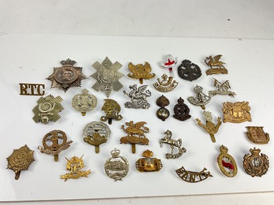 Lot 592 - Collection of thirty British Military cap badges to include Royal Signals, Tank Corps and Middlesex Regiment (1 box )