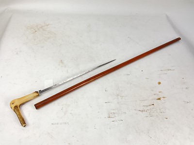 Lot 924 - 19th century dagger cane with etched taper blade and stag horn grip