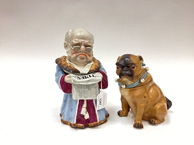 Lot 1347 - Two late 19th century Continental porcelain novelty tobacco jars, old man reading The Times and Pug dog (2)