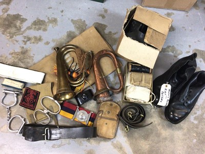 Lot 602 - First World War copper military bugle dated 1916, together with another bugle, canvas webbing, leather belts and a set of hand cuffs (1 box)