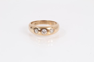 Lot 901 - 9ct gold diamond three stone gypsy ring