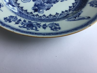 Lot 5 - A rare pair of Chinese blue and white armorial plates, circa 1730