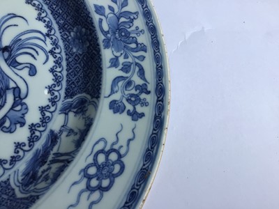 Lot 5 - A rare pair of Chinese blue and white armorial plates, circa 1730
