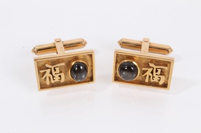 Lot 908 - Pair of 14ct gold cufflinks, each rectangular panel set with a dark grey cabochon and Chinese character mark decoration