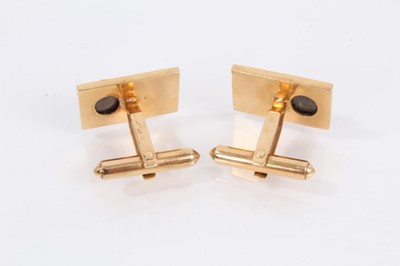 Lot 908 - Pair of 14ct gold cufflinks, each rectangular panel set with a dark grey cabochon and Chinese character mark decoration