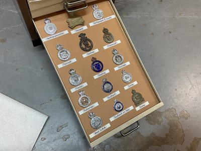 Lot 622 - Thirty draws containing a well presented collection of British Police badges and insignia with annotations, contained in a metal filing cabinet.