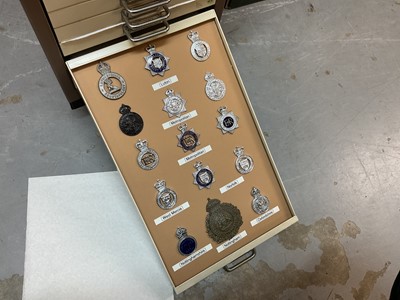 Lot 622 - Thirty draws containing a well presented collection of British Police badges and insignia with annotations, contained in a metal filing cabinet.