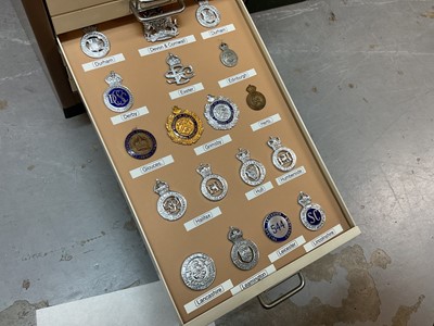 Lot 622 - Thirty draws containing a well presented collection of British Police badges and insignia with annotations, contained in a metal filing cabinet.