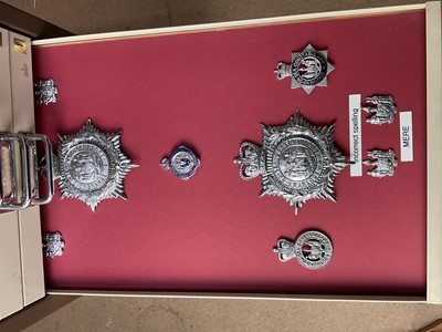 Lot 622 - Thirty draws containing a well presented collection of British Police badges and insignia with annotations, contained in a metal filing cabinet.