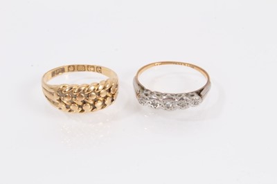 Lot 919 - Edwardian 18ct gold double row rope twist ring and 18ct gold diamond five stone ring (2)