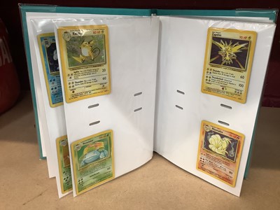 Lot 1521 - Pokémon cards to include rare base set Wizards of the coast Charizard 4/102 in very good condition with fourteen other Holographic Cards and others