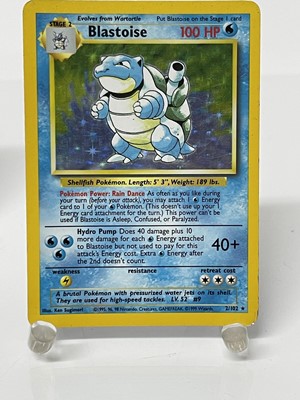 Lot 1521 - Pokémon cards to include rare base set Wizards of the coast Charizard 4/102 in very good condition with fourteen other Holographic Cards and others