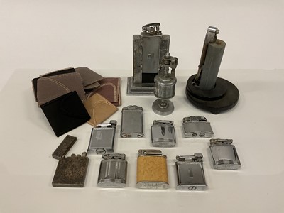 Lot 2620 - Collection of mixed lighters to include a white metal example and several other engine turned decorated lighters.