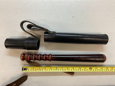 Lot 620 - Two mounted Police batons in leather sheaths and lot truncheons