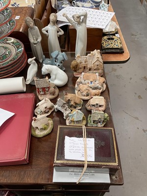 Lot 596 - Ten Lilliput Lane cottages, five Lladro figures, a Wade animal and assorted coins