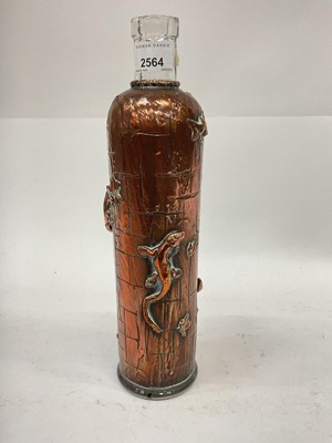 Lot 2564 - Cooper covered glass bottle decorated with lizards and leaves, 33cm high