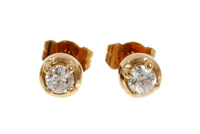 Lot 499 - Pair of diamond single stone earrings in 18ct gold setting, together with a single diamond stud earring.