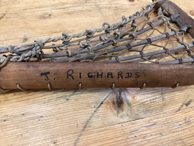 Lot 2502 - Two old lacrosse sticks and an old discus (3)