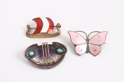 Lot 953 - Norwegian silver and enamel Viking longship brooch, silver and enamel butterfly brooch and an Art Nouveau silver, shell and turquoise cabochon brooch (3)