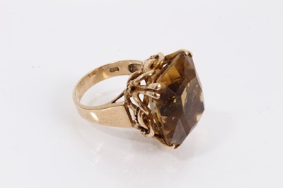 Lot 957 - 9ct gold citrine cocktail ring in claw setting with a woven rope twist gallery