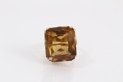 Lot 957 - 9ct gold citrine cocktail ring in claw setting with a woven rope twist gallery