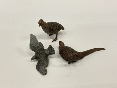 Lot 2573 - Three miniature cold painted birds