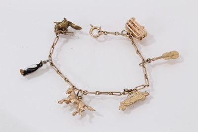 Lot 513 - Three Edwardian gem-set brooches and a gold charm bracelet