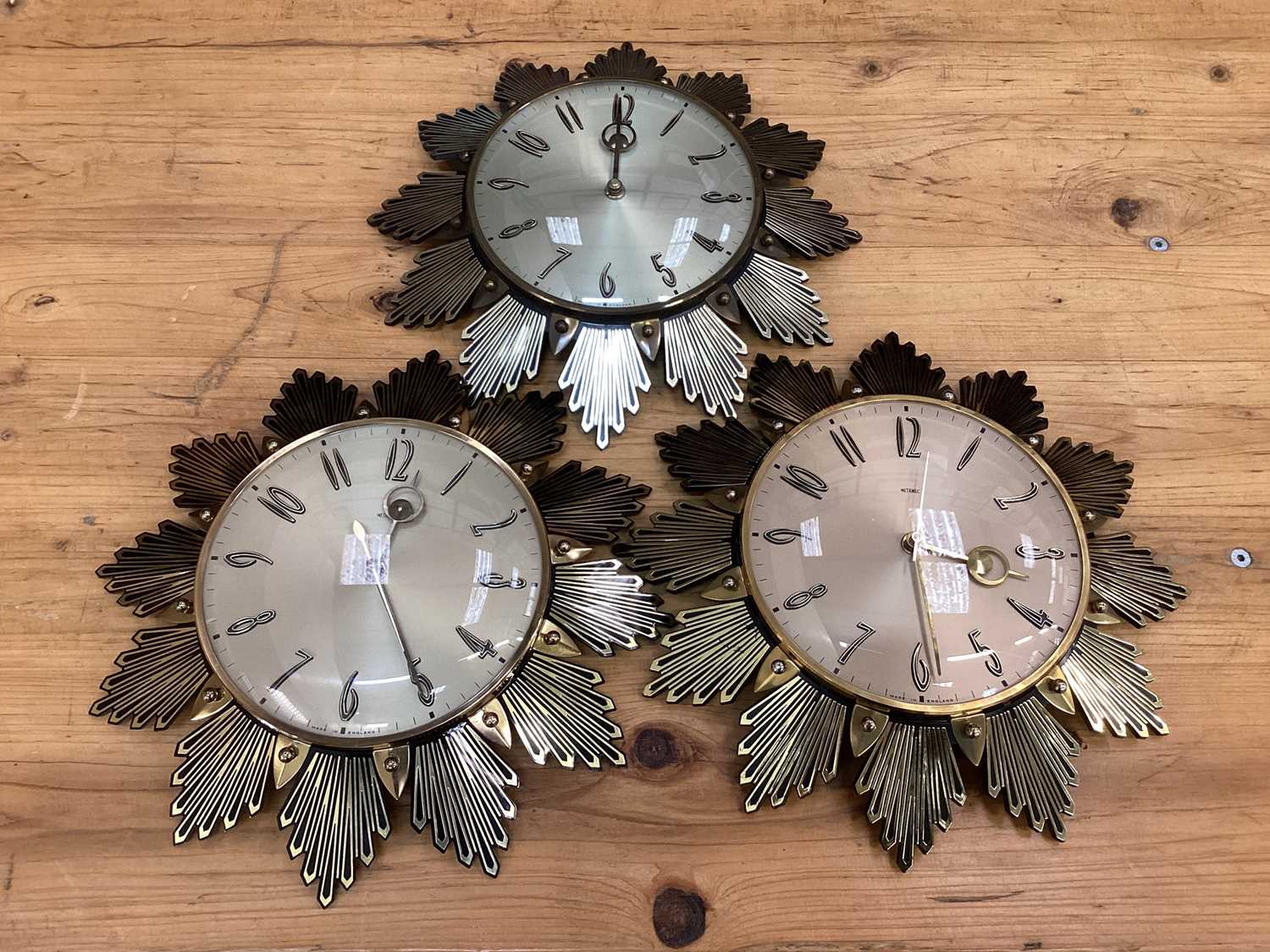 Lot 2576 Three Metamec sunburst wall clocks, 32cm