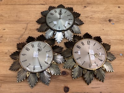 Lot 2576 - Three Metamec sunburst wall clocks, 32cm diameter