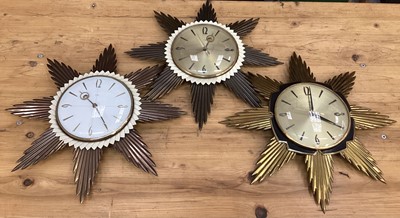 Lot 2577 - Three Metamec sunburst wall clocks, 45cm diameter