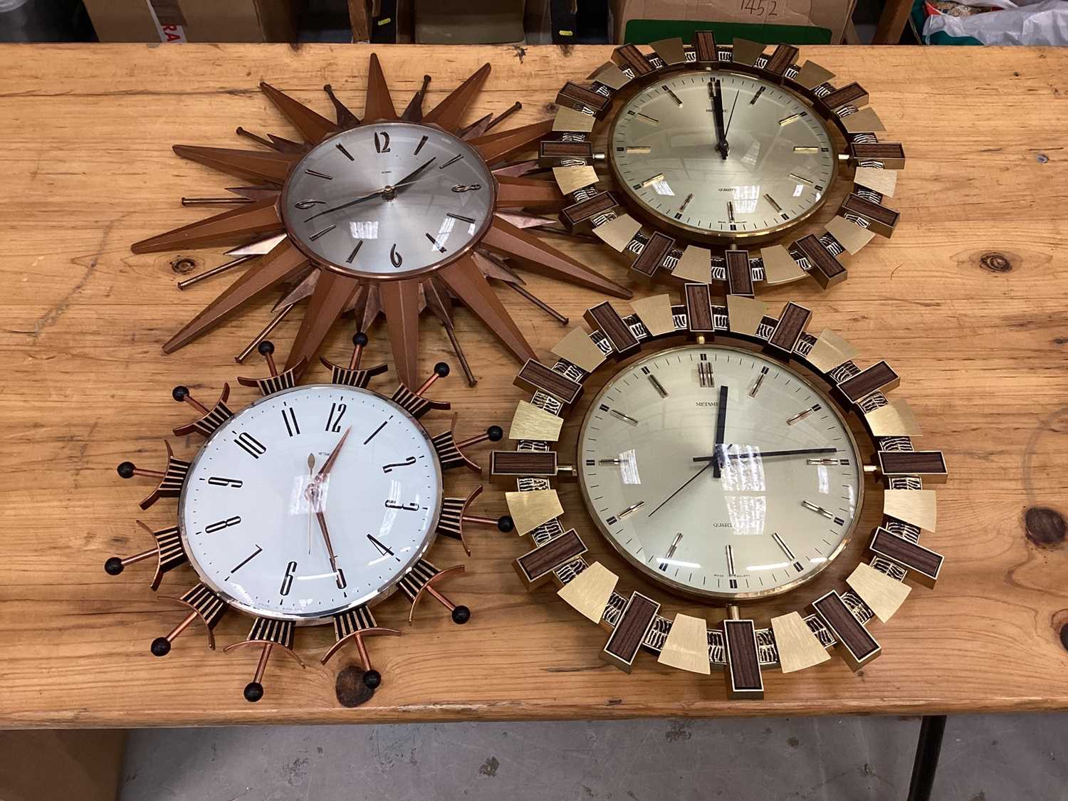 Lot 2578 Four Metamec sunburst type wall clocks