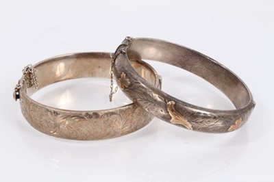 Lot 975 - Four silver hinged bangles