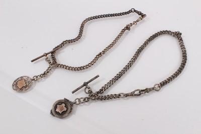 Lot 976 - Two silver watch chains, both with silver fobs